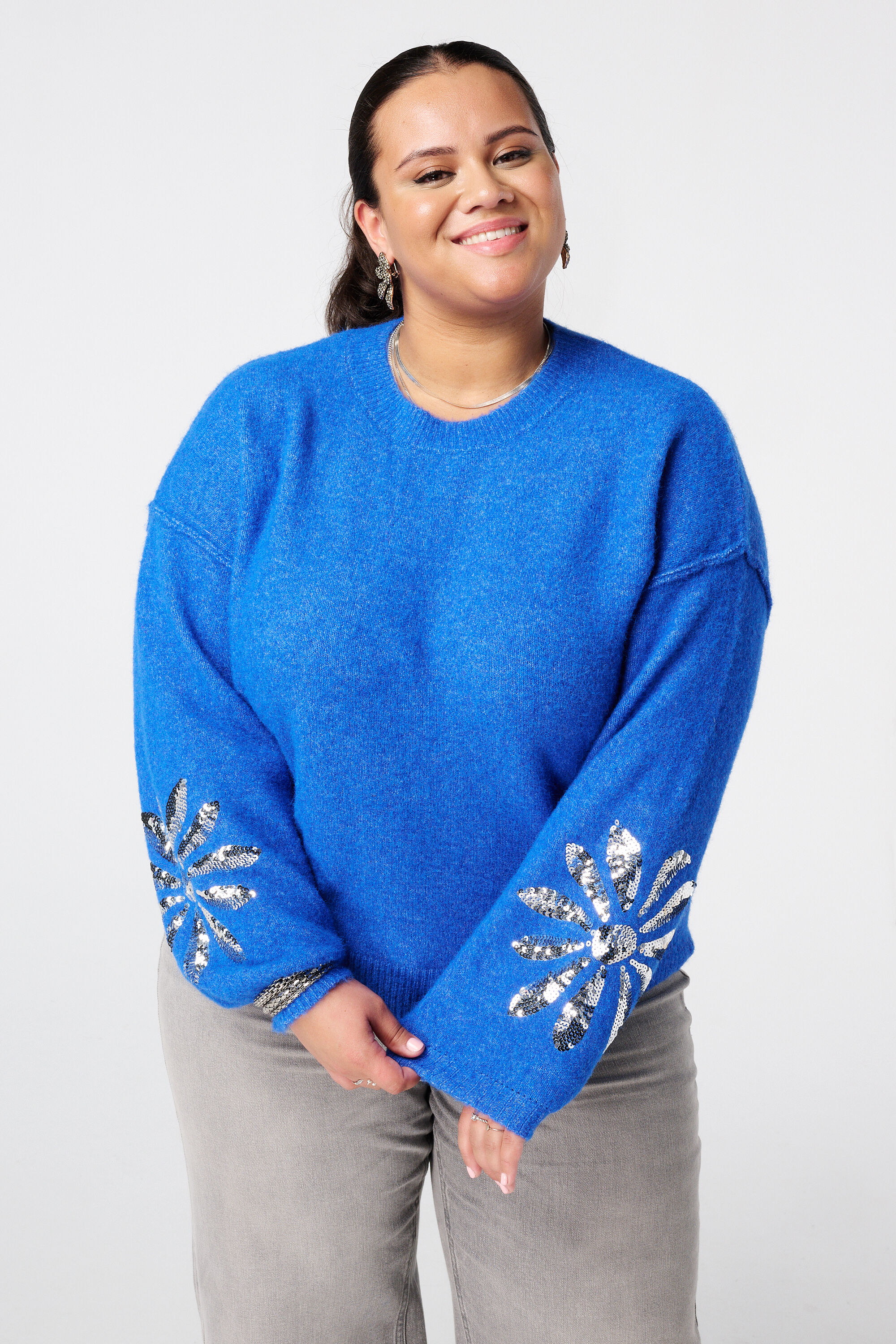 Jersey de punto con lentejuelas en las mangas