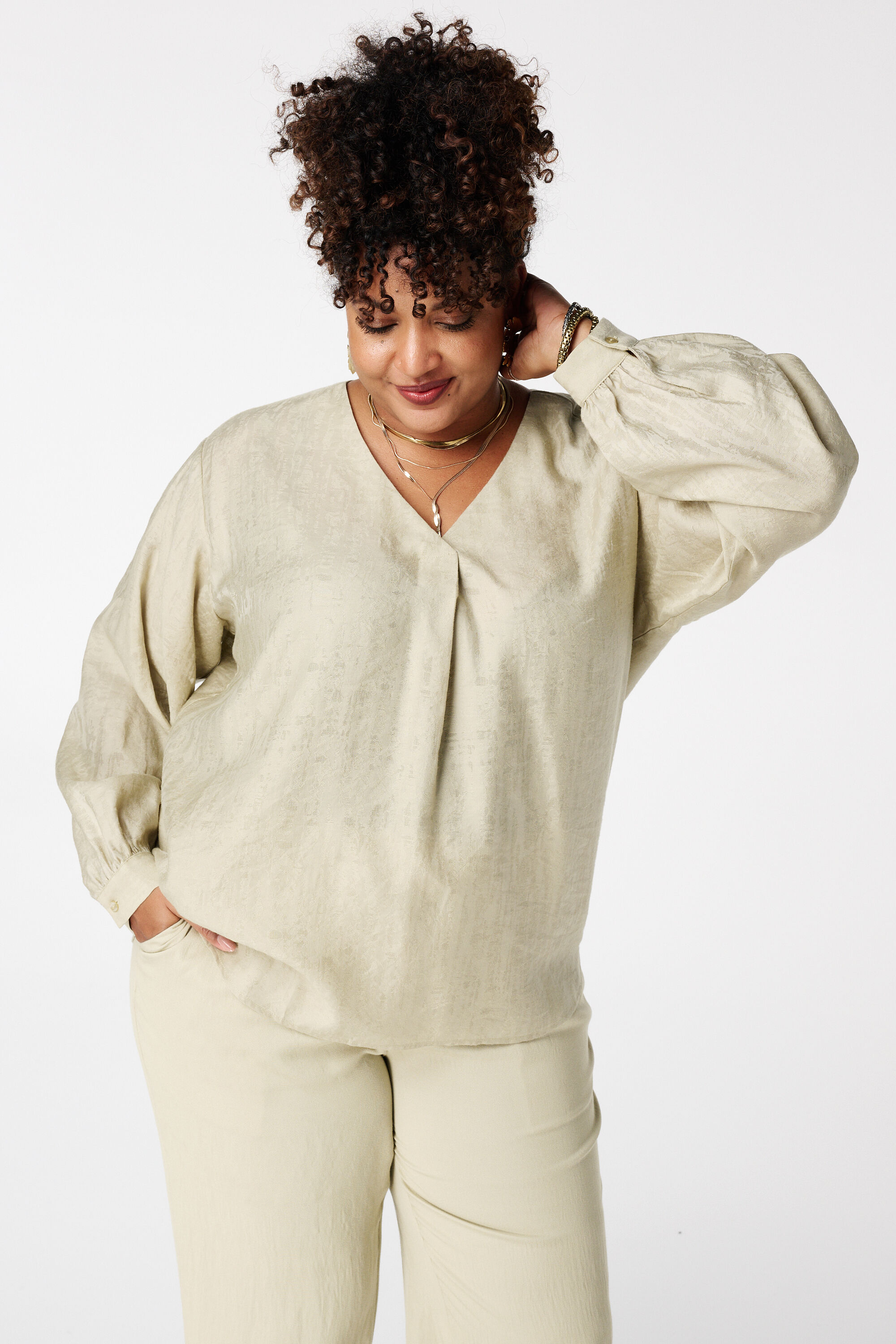 Blusa con aspecto satinado